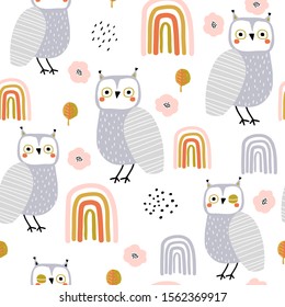 Seamless pattern with owls and rainbows. Creative holiday texture. Great for fabric, textile Vector Illustration