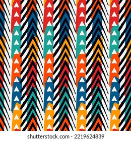 Seamless pattern. Paint brush chevrons, triangles and lines ornament. Hand drawn geometrical backdrop. Triangular shapes wallpaper. Geometric figures background. Ethnic motif. Textile print vector.