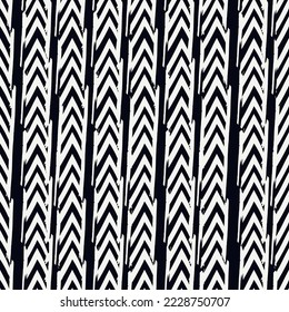 Seamless pattern. Paint brush chevrons and lines ornament. Hand drawn geometrical backdrop. Triangular shapes wallpaper. Geometric background. Ethnic motif. Arrows textile print. Vector abstract.