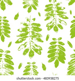 Seamless pattern with paint prints of leaves