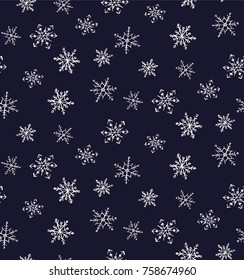 Seamless pattern of painted snowflakes on a black background.