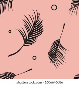 Seamless pattern with palm branches on a pink background