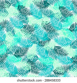 Seamless pattern of palm leaves branches superimposed on each other beautifully in blue azure and aquamarine color on a light gray background