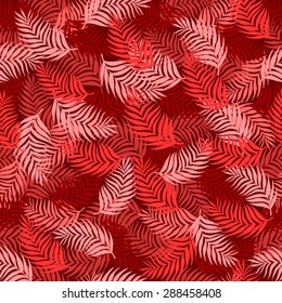 Seamless pattern of palm leaves branches superimposed on each other beautifully in red