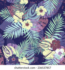 Seamless pattern with palm leaves and flowers.