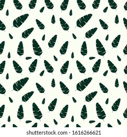Seamless pattern of palm leaves on a white background.  Trendy texture with tropic plants. Design featuring monstera plant for wallpaper, fabric, gift paper, postal packaging.