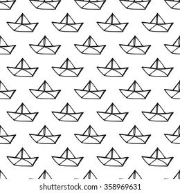 Seamless pattern with paper ships. Hand drawn background.