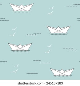Seamless pattern with paper ships, waves and seagulls