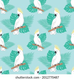 Seamless pattern with parrots and leaves. Cockatoo on light blue background. Vector design for paper, cover, fabric, gift wrap, interior.