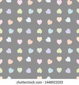 Seamless pattern in pastel light pink, green, blue, orange and violet hearts on grey background for fabric, textile, clothes, tablecloth and other things. Vector image. 

