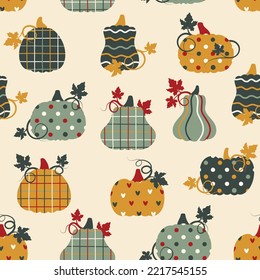 Seamless pattern with patchwork pumpkins with different prints on them. Vector illustration.