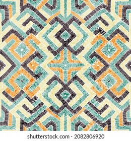 Seamless pattern in patchwork style. Embroidered print for carpet, textile, wallpaper, wrapping paper. Ethnic and tribal motifs. Handwork. Vector illustration.