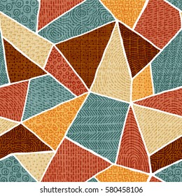 Seamless pattern of patchwork. Vintage geometric background. Blue, brown, beige and mustard color. Vector illustration.