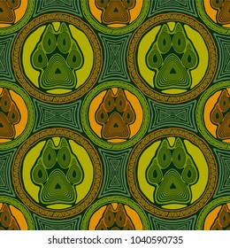Seamless pattern with paw and claws made in a decorative manner and boho style in yellow, green, orange colors