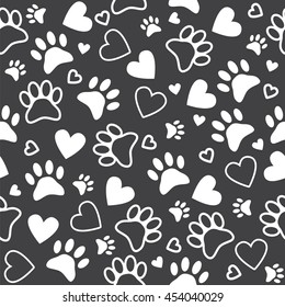 Seamless pattern with paw and heart prints. Cute animal footprint background. Vector illustration