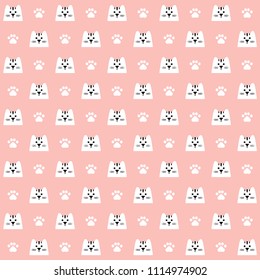 Seamless pattern with paw print and cat face. White pawprint and cat head on rosy background. Design for textile, wallpaper, fabric. Pet care symbol. Repeat ornament