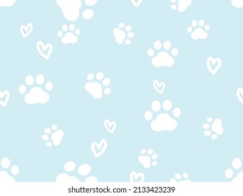 Seamless pattern with paw prints and hand drawn hearts on pastel blue background vector illustration.