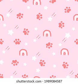 Seamless pattern with paw prints, stars and rainbows on pink background vector illustration.