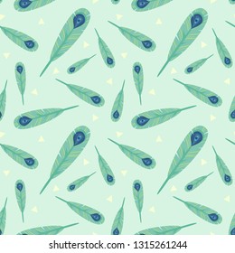 Seamless pattern peacock feather on green background