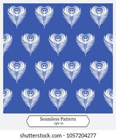 Seamless Pattern with peacocks feathers on the blue background