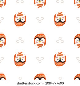 Seamless pattern with penguins in children style with holiday decorations for New Year and Christmas. Festive print of funny animals with caps and bows. Vector flat illustration