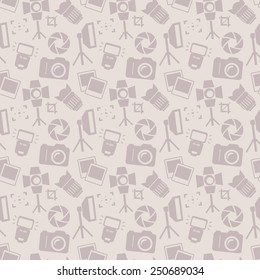 Seamless pattern with photo equipment and symbols. Background with silhouette icons for photographic theme. Vector illustration.