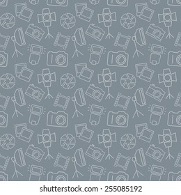 Seamless pattern with photo equipment and symbols. Gray background with line icons for photographic theme. Vector illustration.