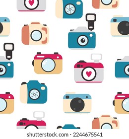 Seamless pattern with photocameras flat icons. Colourful handdrawn digital cameras.