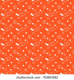 Seamless pattern with pills on orange background.