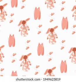 Seamless pattern with pink baby clothes