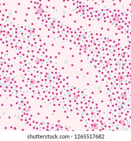 Seamless pattern. pink and blue  dots on a light pink background. Texture. Vector