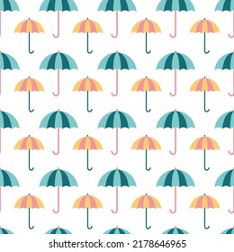 Seamless pattern with pink and blue umbrellas