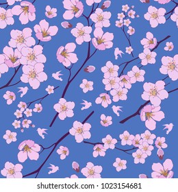 Patrón sin fisuras de flores de cerezo rosa sobre un fondo azul