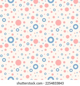 Seamless pattern of pink circles and blue rings