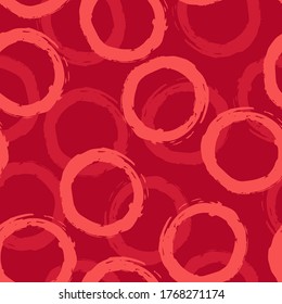Patrón sin brillo con círculos rosados sobre fondo rojo. Diseño de vectores para textiles, fondos, ropa, papel de embalaje, sitios web y papel tapiz. Ilustración de moda sin fisuras.