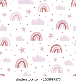 Seamless pattern with pink clouds, stars and rainbows.