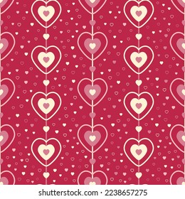 Seamless pattern of pink and cream hearts on strings surrounded by smaller hearts on a magenta background.
