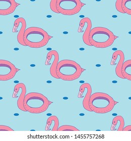 Seamless pattern with pink flamingo lifebuoy on blue background. Summer wallpaper. 