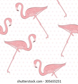 Seamless pattern with pink flamingos in the background of polka dots.