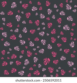 Seamless pattern of pink floral designs on a dark gray background.