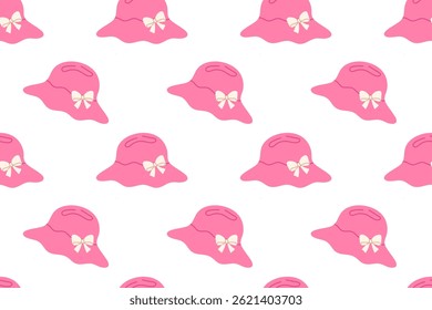 Seamless pattern with pink hats and beige bows on white background