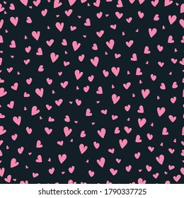 A seamless pattern with pink  hearts on a black background, vector illustration