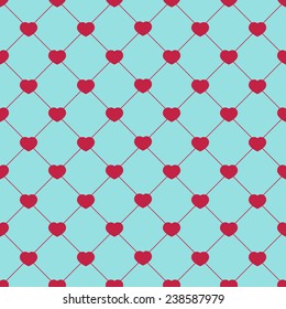 Seamless pattern with pink hearts on diamond-shaped blue background. Vector illustration.