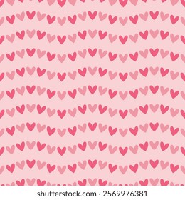 Seamless pattern with pink hearts on a light pink background. Vector Valentine's Day background.