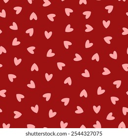 Seamless pattern with pink hearts for Valentine's Day. Gift print for the holiday of love. Small hearts on a red background for textiles, gift wrapping, and design. Heart motif
