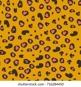 Seamless pattern with pink leopard spots on an orange background. Animal skin.
