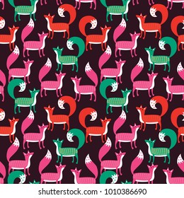 Seamless pattern. Pink, orange and green foxes on a dark brown background.