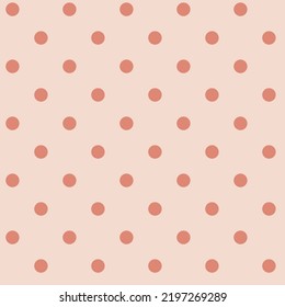 Seamless pattern in pink polka dots on a light background