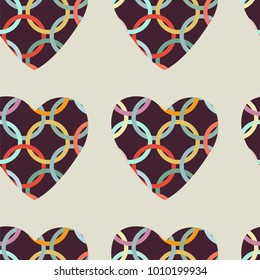 Seamless pattern with pink and red hearts. Decorative vector illustration.