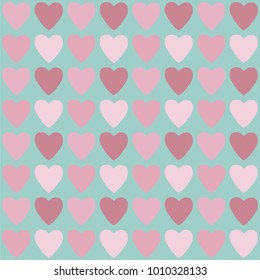 Seamless pattern with pink and red hearts. Decorative vector illustration.